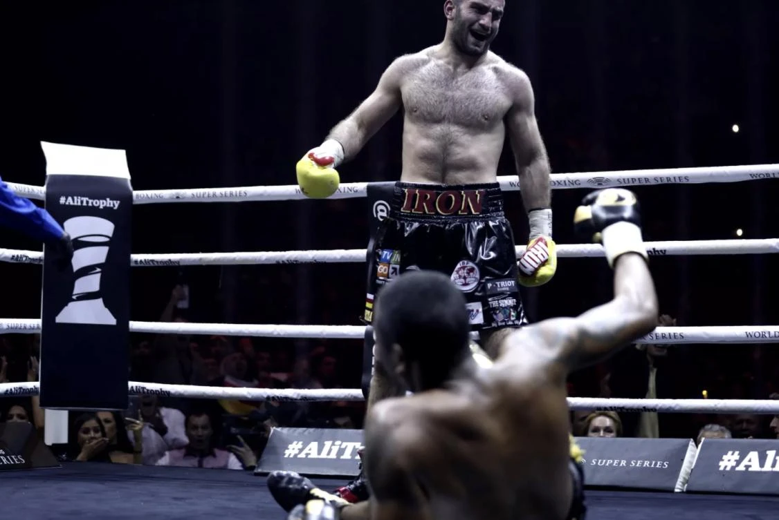 Murat Gassiev stands over Yunier Dorticos after knocking the Cuban to the floor. (Getty)