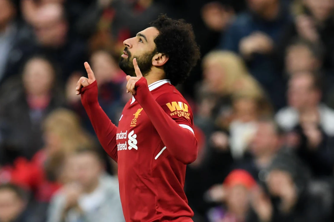 Liverpool's Mohamed Salah celebrates scoring against Tottenham Hotspur at Anfield. (AFP)