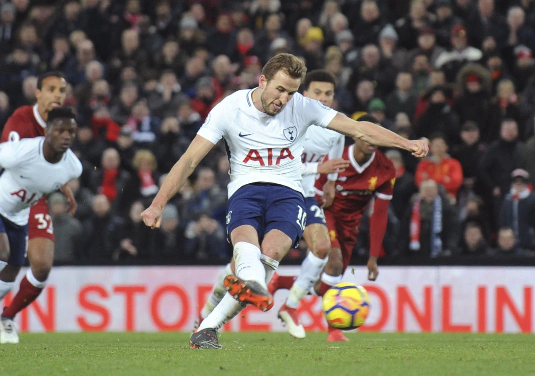 Tottenham's Harry Kane scores his side's second goal during the English Premier League soccer match between Liverpool and Tottenham Hotspur at Anfield. (AP)