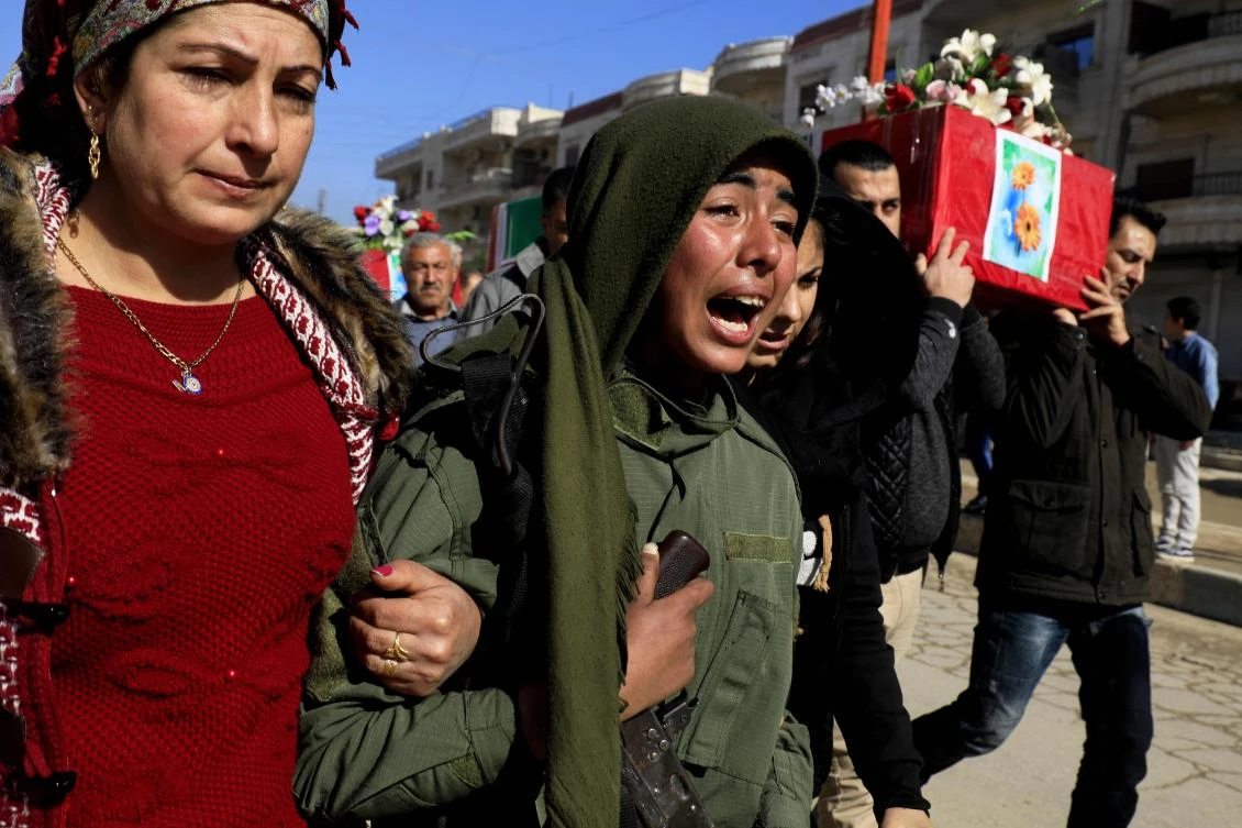 Syrian Kurds mourn during a funeral in the town of Afrin on January 29, 2018, of civilians and fighters from the Syrian Kurdish People’s Protection Units (YPG) who were killed in battles in Syria’s border region of Afrin as the Turkish army press an offensive against Kurdish militia in the area. (AFP)