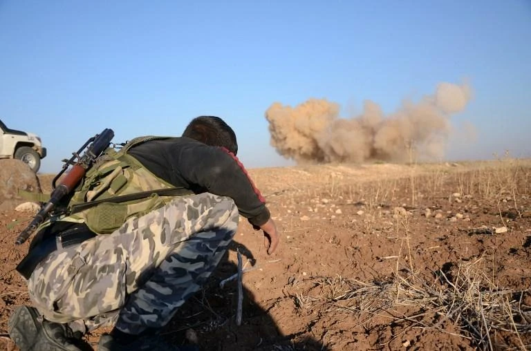 A rebel fighter reacts as a landmine, planted by Daesh, is exploded by his comrades in northern Syrian. (AFP)