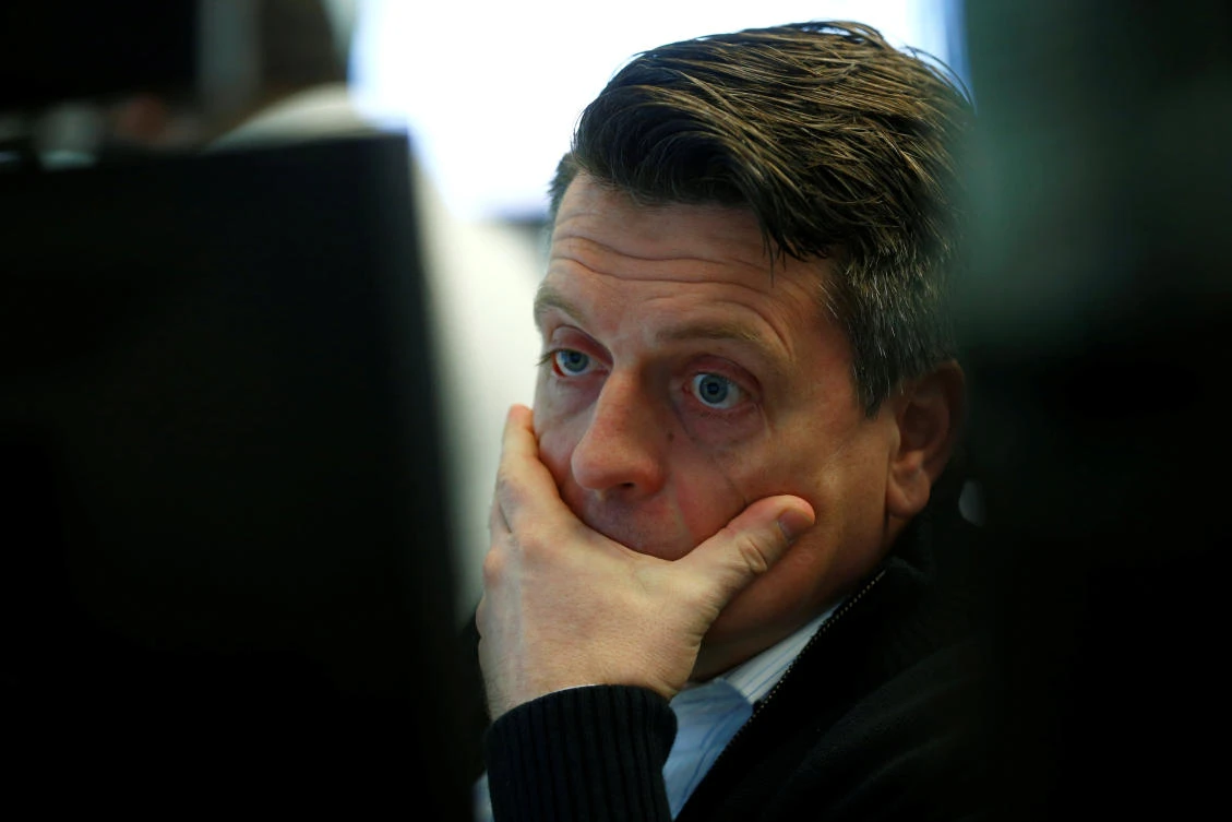 A trader reacts at Frankfurt’s stock exchange amid a global stock rout yesterday. (Reuters)
