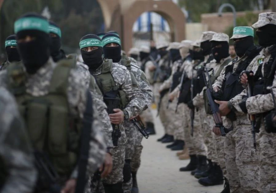 Hamas militants take part in a rally. A Hamas member suspected of murdering a rabbi has been shot dead by Israeli forces. (Reuters)