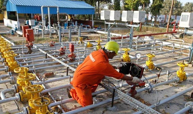 Above, a technician works inside the Oil and Natural Gas Corp. gathering station on the outskirts of the western Indian city of Ahmedabad in this 2012 photo. (Reuters)