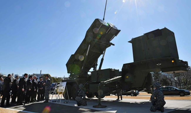 US Vice President Mike Pence, sixth from left, inspects a PAC-3 surface-to-air missile system during a visit to the Defense Ministry in Tokyo on February 7. Pence pledged that Washington would continue to deploy some of its “most advanced military assets to Japan and the wider region” to protect against the threat posed by North Korea. (AFP)