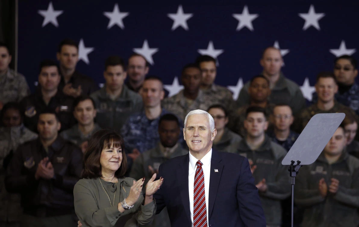 US Vice President Mike Pence, center right, arrives with his wife Karen as he addresses members of American military services and Japan Self-Defense Force before he departs for South Korea to attend the Pyeongchang Winter Olympics. (AP)