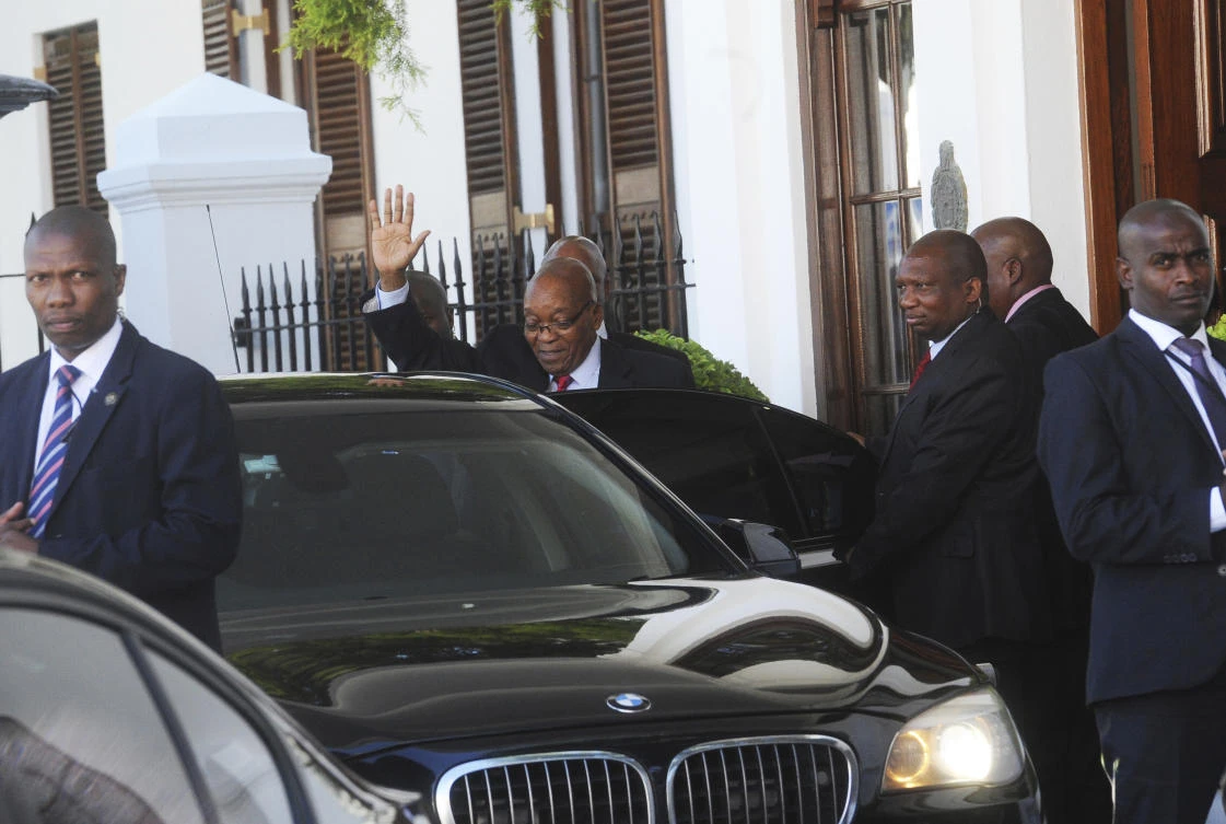 South African President Jacob Zuma waves as he leaves parliament in Cape Town on Tuesday, February 6. (AP)