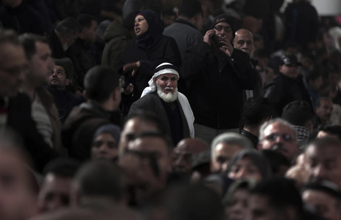 Palestinians wait their turn to cross into Egypt at Rafah, in the southern Gaza Strip, after Egyptian officials opened the border with Gaza for the first time this year. (AP Photo)