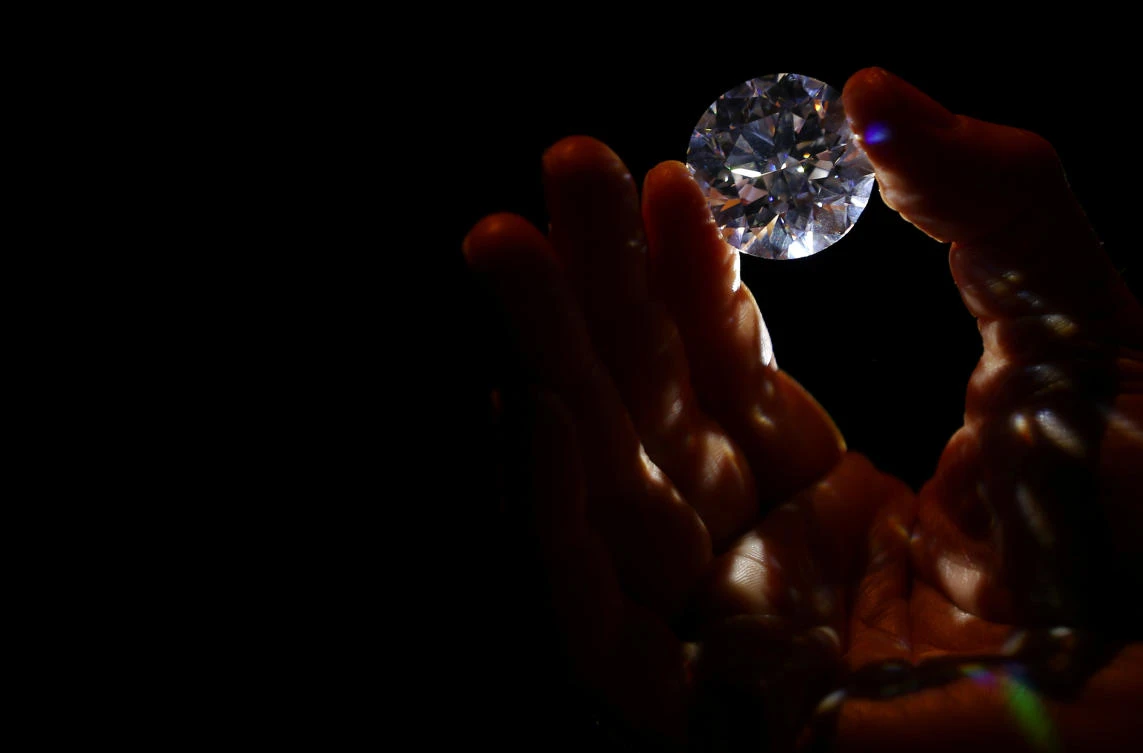 LONDON: An assistant holds a 102.34 carat white diamond at Sotheby's auction house in London, Britain February 8, 2017. (reuters)