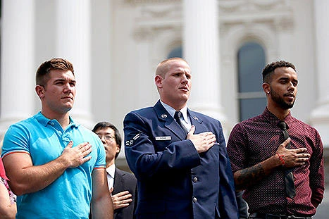 Alek Skarlatos, left, Spencer Stone, center, and Anthony Sadler overpowered a gunman on a Paris-bound train in 2015. The three childhood friends play themselves in a movie about the incident, opening in US movie theaters on Friday. (Getty Images)