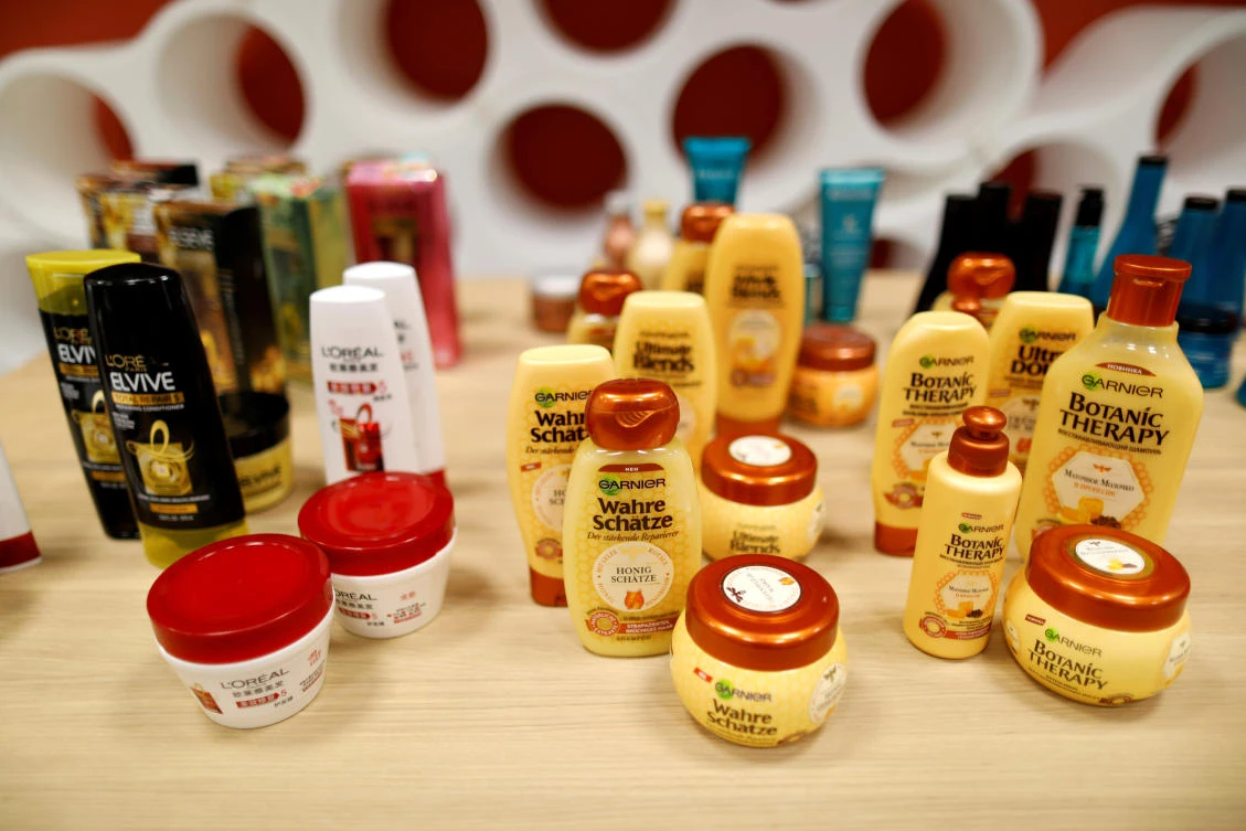 Bottles of shampoos, conditioners and color spray are displayed at cosmetics company L'Oreal's new World hair research centre in Saint-Ouen near Paris. (Reuters)