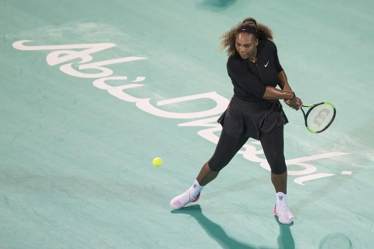 Serena Williams of the US returns the ball to Jelena Ostapenko of Latvia during the Mubadala World Tennis Championship 2017 match in Abu Dhabi, on December 30, 2017. (AFP)
