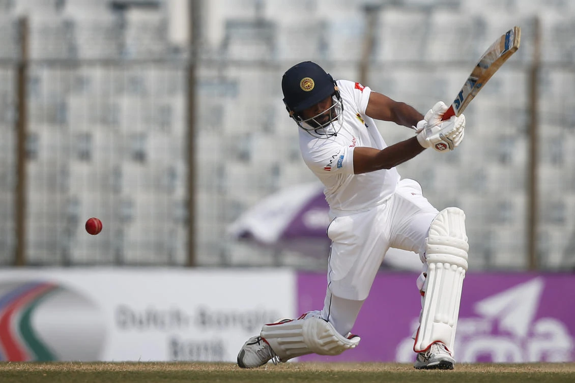 Sri Lanka's Dilruwan Perera plays a shot during the fourth day of their first test cricket match against Bangladesh in Chittagong, Bangladesh, Saturday, Feb. 3, 2018. (AP)