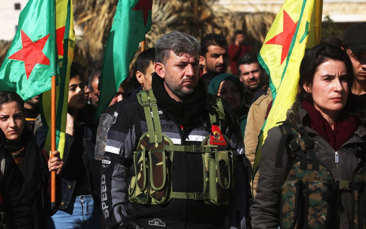 Syrian-Kurds attend an impromptu parade in Afrin as civilians enlist to fight an assault by Turkish troops and allied rebels on the Kurdish People’s Protection Units (YPG) in Syria’s border region on January 28, 2018. (AFP)