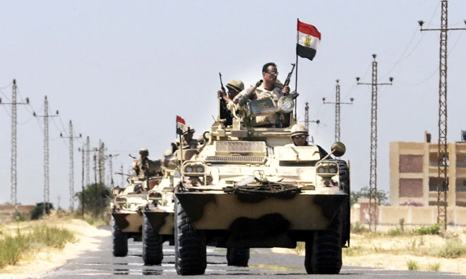 Army vehicles patrol the streets in Egypt's North Sinai. (AFP)