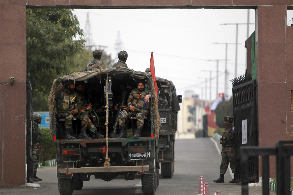 Indian soldiers arrive to take position at an army camp in Jammu. S.P. Vaid, the region's top police official, said the three militants were killed by late Sunday night. (AP Photo)