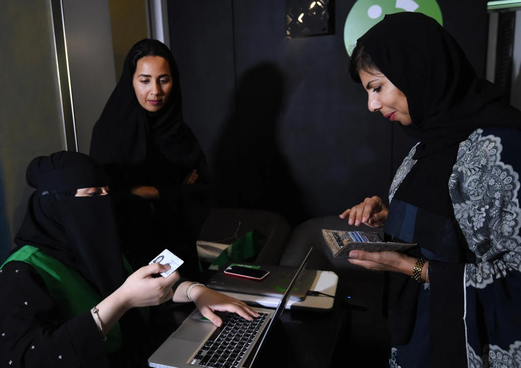 A Saudi woman registers to take part in a training program for new female drivers at Careem, a chauffeur driven car booking service, at their Saudi offices in Khobar City, some 424 kilometers east of the Saudi capital of Riyadh, on October 10, 2017. (AFP)