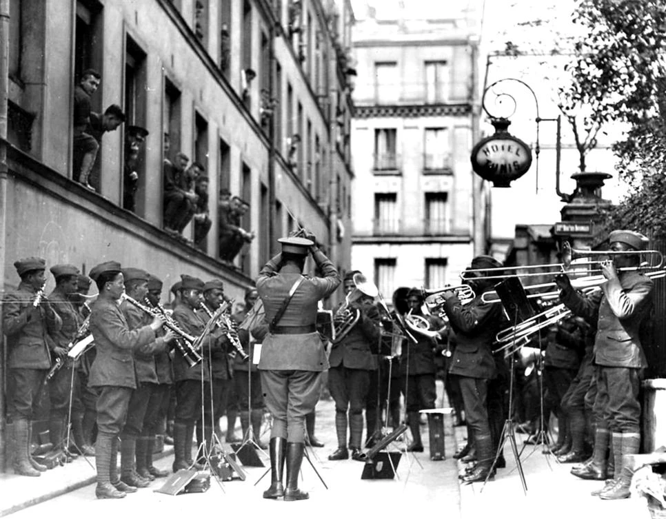 The US 369th Infantry Regiment Jazz orchestra conducted by James Reese performs for war wounded in front of the Hotel de Tunis in this photo taken in 1918 in Paris. (Signal Corps USA via AFP)