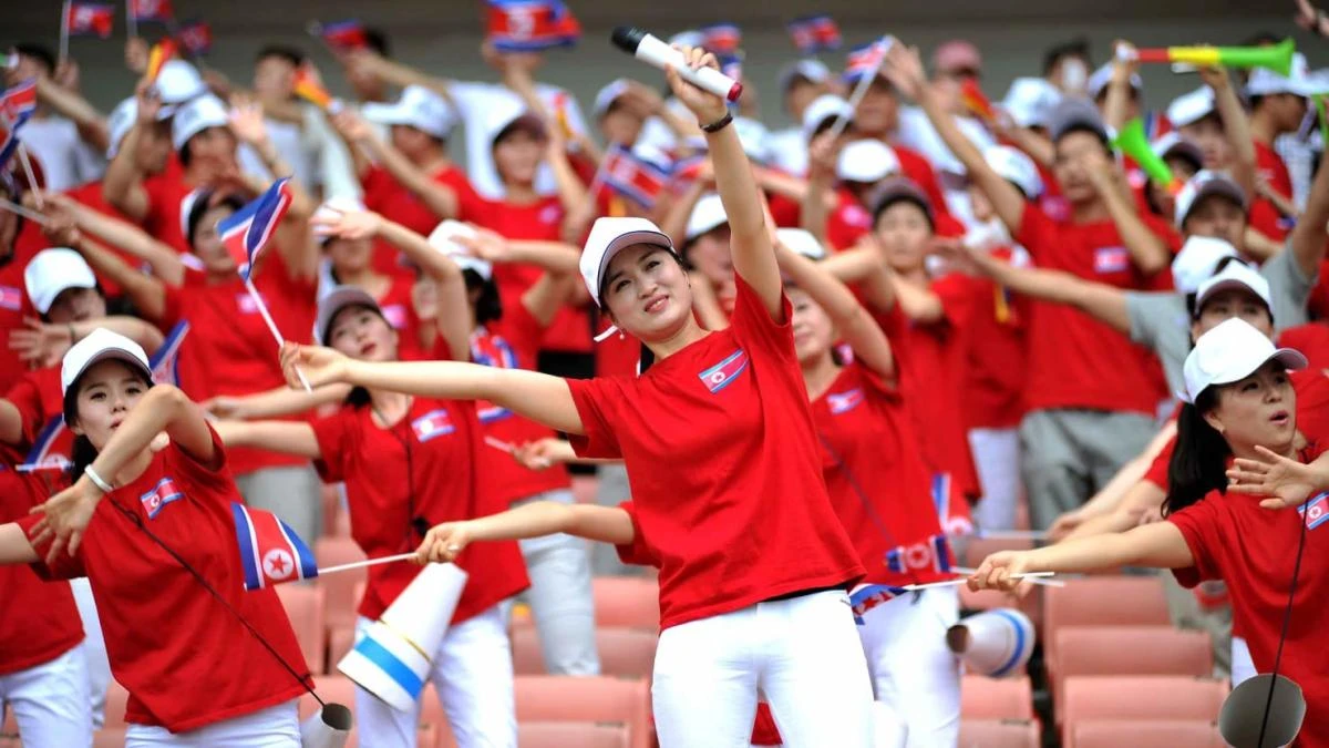 Dubbed ‘the army of beauties,’ the cheerleaders waved small flags. (File photo: AP)