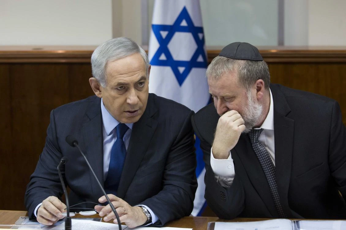 Israeli Prime Minister Benjamin Netanyahu speaks with Israeli Attorney General Avichai Mandelblit. AG Mandelblit asked police to delay issuing their recommendations into two corruption allegations against Netanyahu until the Supreme Court hears a petition against them. (File Photo: AFP)