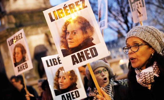 Demonstrators hold posters reading, ‘Release Ahed.’ Palestinian Ahed Tamimi is due to appear before an Israelimilitary court today, charged with slapping and punching two Israeli soldiers in December. The teenager hasbecome a hero for Palestinians struggling against military occupation. (AP)