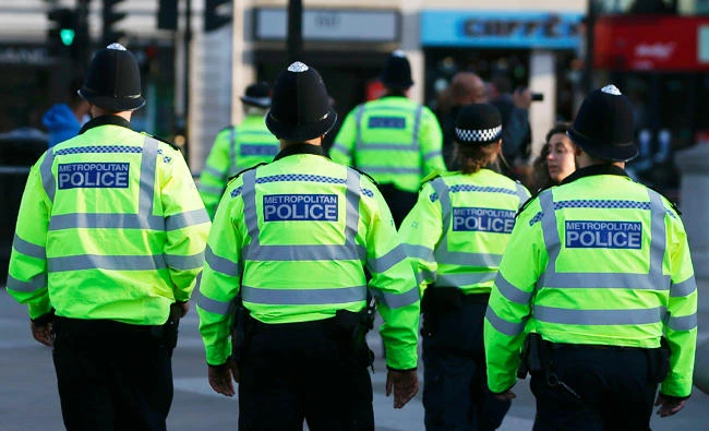 British police patrol through Trafalgar Square in central London, in this May 23, 2017 file photo, a day after a deadly terror attack at the Ariana Grande concert at the Manchester Arena. (AFP)