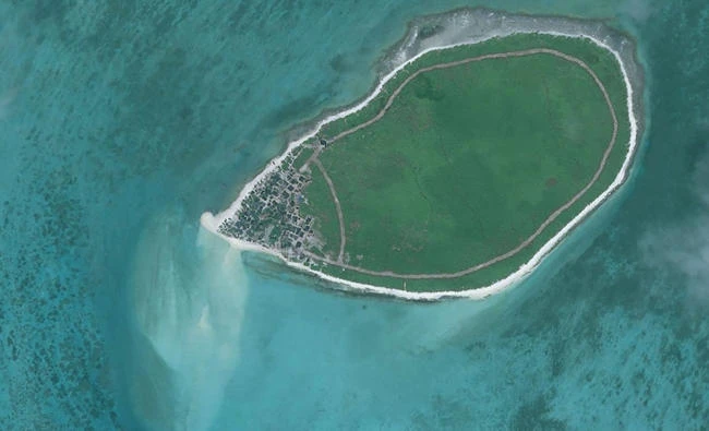 This handout photo taken on December 14, 2012 by satellite imagery provider DigitalGlobe and released to AFP on August 11, 2017 by the Asia Maritime Transparency Initiative (AMTI) department at the Center for Strategic and International Studies (CSIS) think tank shows an overview satellite image of Tree Island in the disputed Paracels island chain in the South China Sea. (AFP)