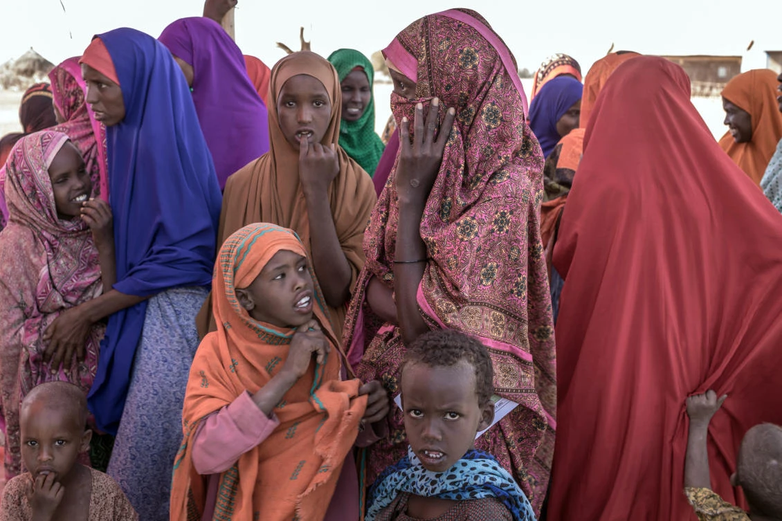 People gather prior to a food distribution at the Internally displaced person camp (IDP) of Farburo in Gode, near Kebri Dahar, southeastern Ethiopia, on January 27, 2018. (AFP)