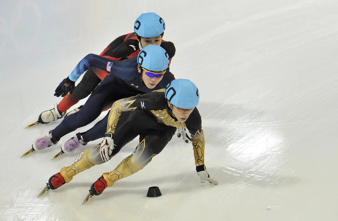 Japan’s Kei Saito leads in front of Thomas Insuk Hong, of the US and China’s Lu Xiucheng as they compete in the men’s 1000 meter short track speed skating competition during the winter Youth Olympic Games in Innsbruck, Austria in this January 18, 2012 file photo. (AP)