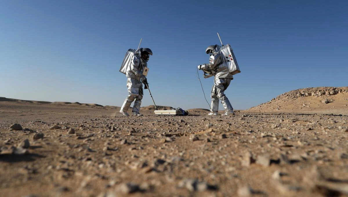 Members of the AMADEE-18 Mars simulation mission wear spacesuits while conducting scientific experiments during an analog field simulation in Oman’s Dhofar desert on February 7, 2018, in a collaboration between the Austrian Space Forum and the Oman National Steering Comittee preparing for future human Mars missions. (AFP)