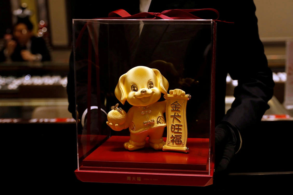 A dog-shaped gold figurine at Chow Tai Fook Jewellery store ahead of the Lunar Year of the Dog in Hong Kong. (REUTERS)