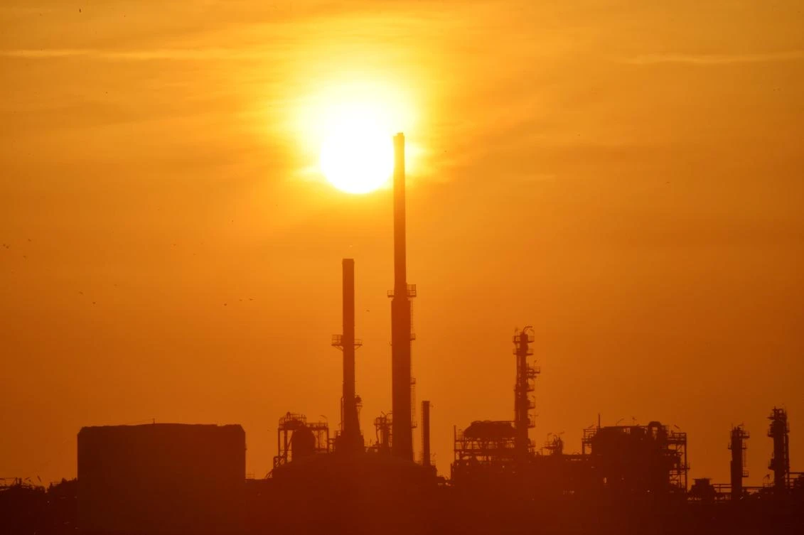 The sun sets over the Total refinery on the Loire River off Donges, western France. (File Photo: AFP)