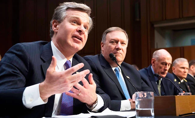 FBI Director Christopher Wray (L) and CIA Director Mike Pompeo (2nd L) testify on worldwide threats during a Senate Intelligence Committee hearing on Capitol Hill in Washington, DC, on Tuesday. (AFP)