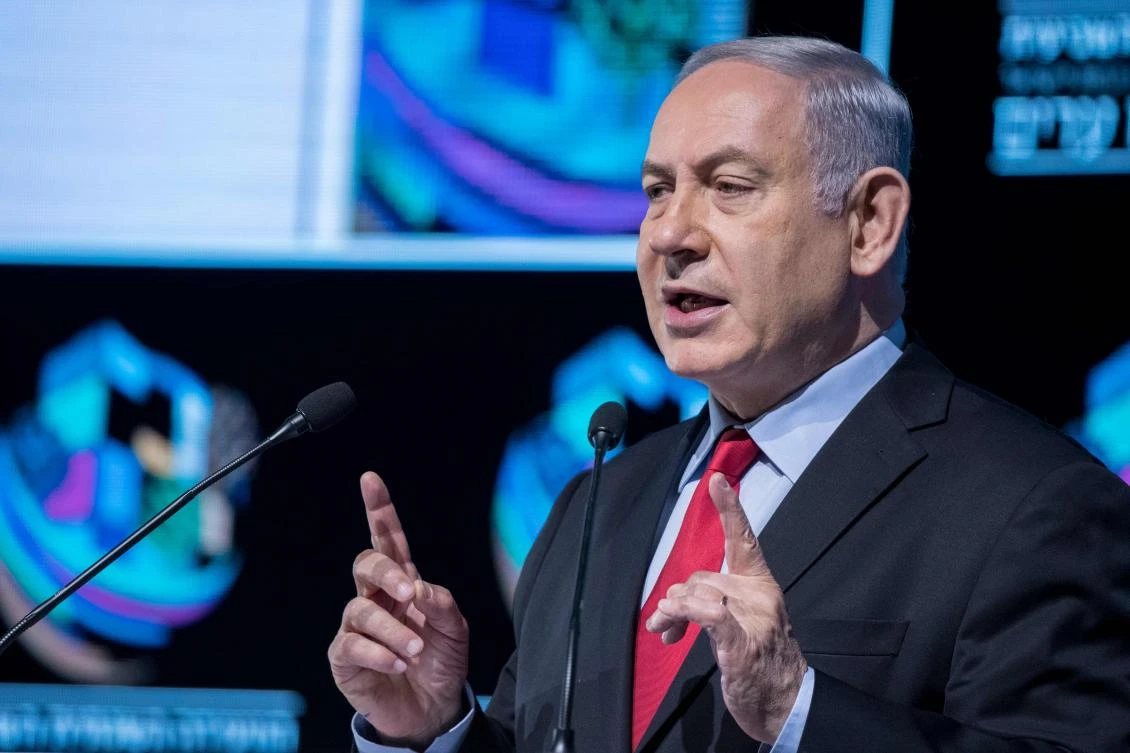 Israeli Prime Minister Benjamin Netanyahu speaks during the Muni World conference in Tel Aviv on February 14, 2018. Netanyahu said today his government was “stable” and criticized the police investigation against him, prompting calls for him to resign. (AFP)