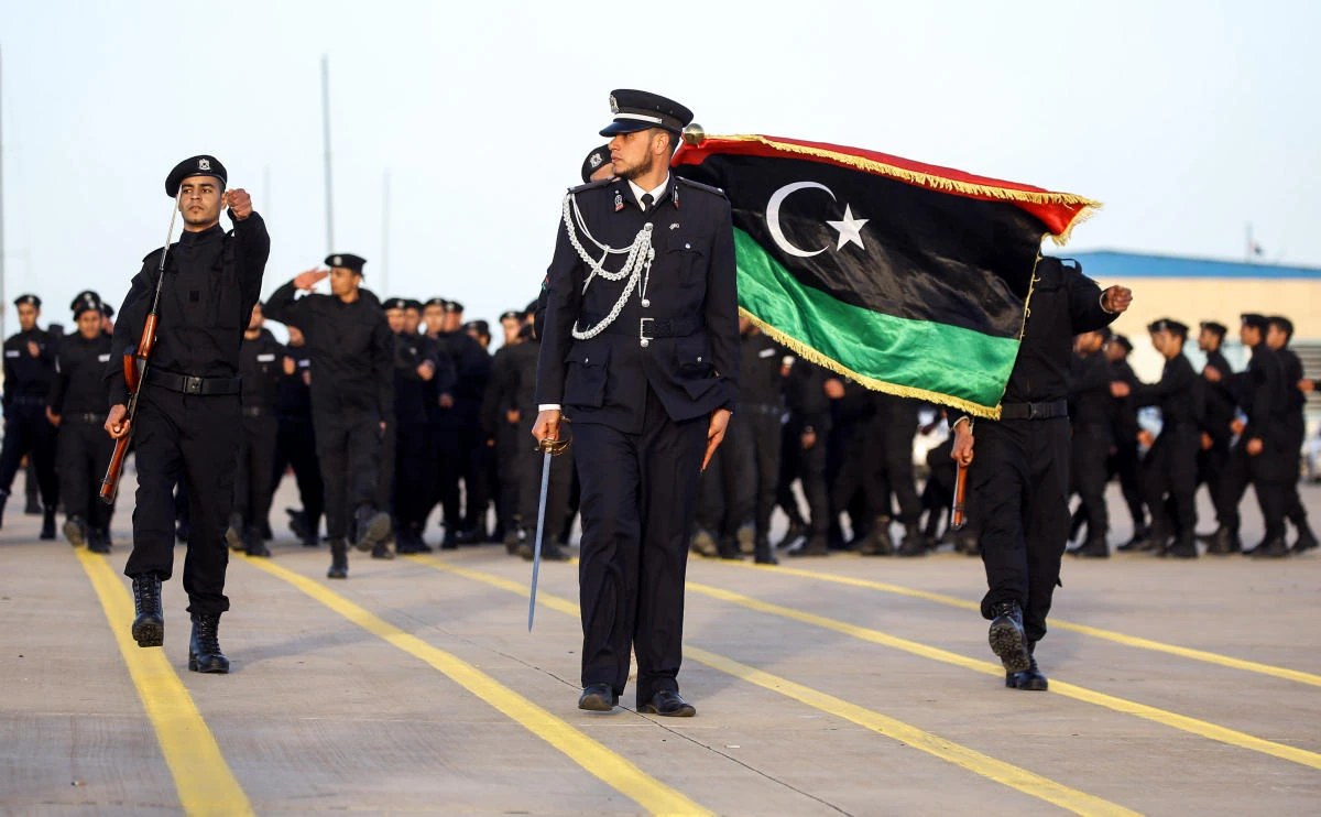 Libyan cadets march a graduation ceremony for a new batch of the unity government's Special Operations Force, at Abu Sitta Naval Base in the capital Tripoli on February 13, 2018, attended by the unity government's prime minister. (AFP)