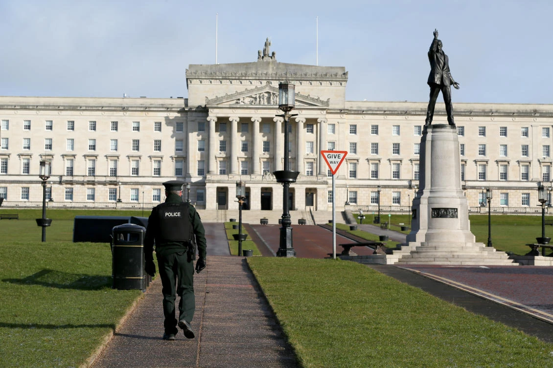 A policeman patrols the Parliament Buildings on the Stormont Estate, the seat of the Northern Ireland assembly, in Belfast: (Paul Faith/AFP)