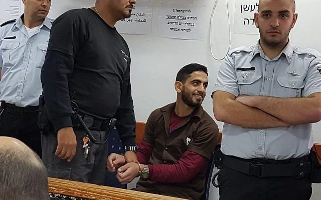Omar Al-Abed, center, ahead of his sentencing by a court at Ofer, near Ramallah in the occupied West Bank. (Courtesy photo)