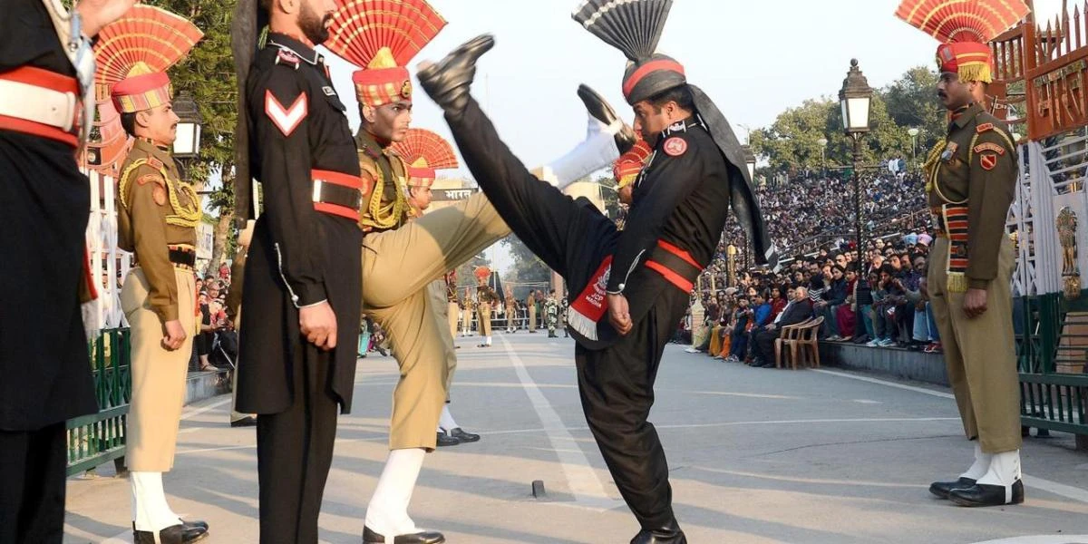Indian and Pakistani guards face off in a border ceremony. Pakistan says Indian forces opened fire across the frontier between the two countries in Kashmir. (Getty Images)