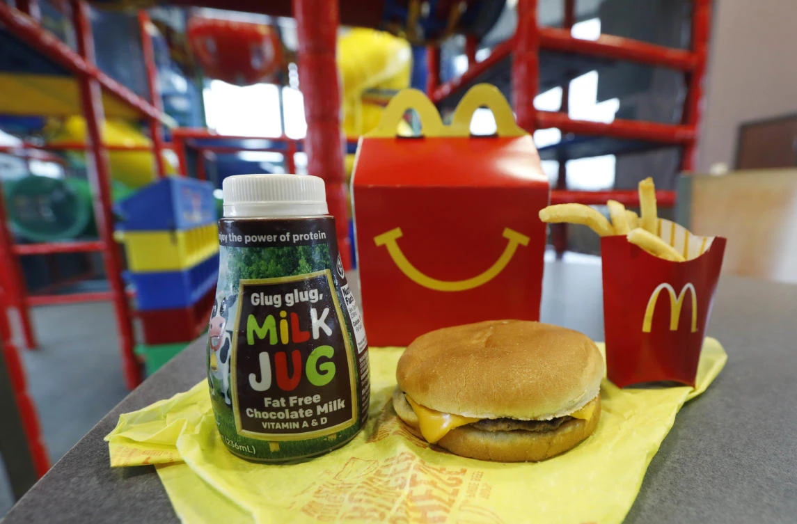 Photo showing a child ‘Happy Meal’ featuring non-fat chocolate milk and a cheeseburger with fries, Feb 14, 2018. (AP)