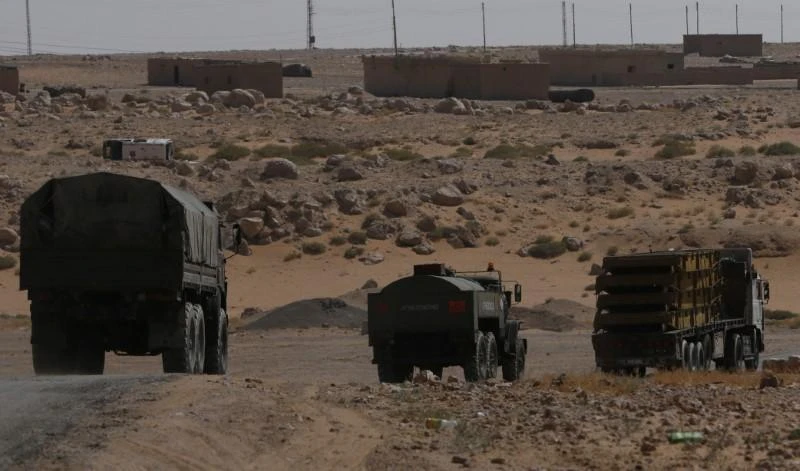 Above, Russian military-type trucks on the road heading to Deir Ezzor in Kabakeb, Syria on September 21, 2017. (Reuters)