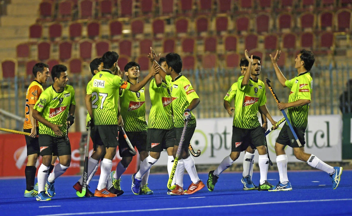 In this file photo, Pakistan field hockey players celebrate after scoring against World XI during their first match at the Abdul Sattar Edhi hockey stadium in Karachi on Jan. 19, 2018. (AFP)