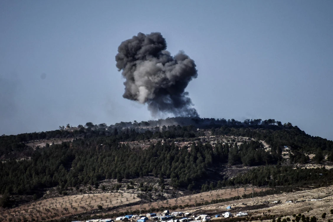 In this Jan. 28, 2018 file photo, a plume of smoke rises from inside Syria, during Turkish forces bombardment, on the Kurdish-controlled enclave of Afrin, Syria, as seen from the border with Syria, in Kilis, Turkey. (AP)