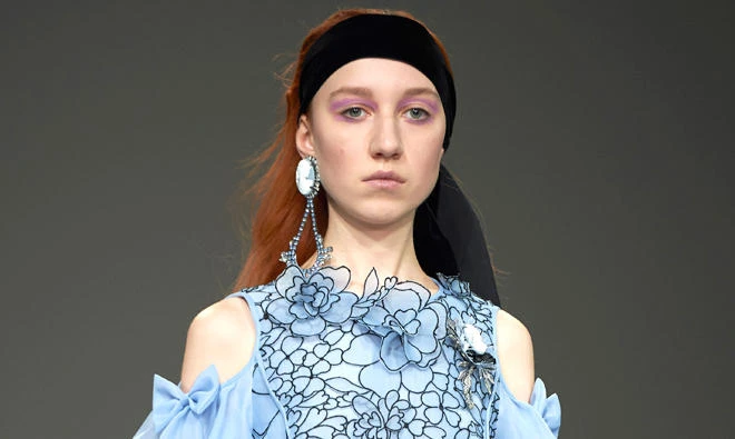 A model presents a creation by designer Bora Aksu at the London Fashion Week. (AFP)