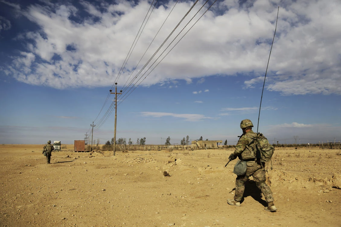 US Army soldiers on a reconnaissance patrol in a rural village near a coalition outpost in western Iraq. (AP/Susannah George)