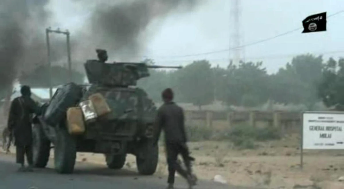 This screen grab image taken on Jan. 2, 2018 from a video released by Islamist group Boko Haram shows Boko Haram fighters during a Christmas Day attack on a military checkpoint in Molai village on the outskirts of the northeast Nigerian city of Maiduguri, which the military said was thwarted by troops after one hour of battle. (AFP)