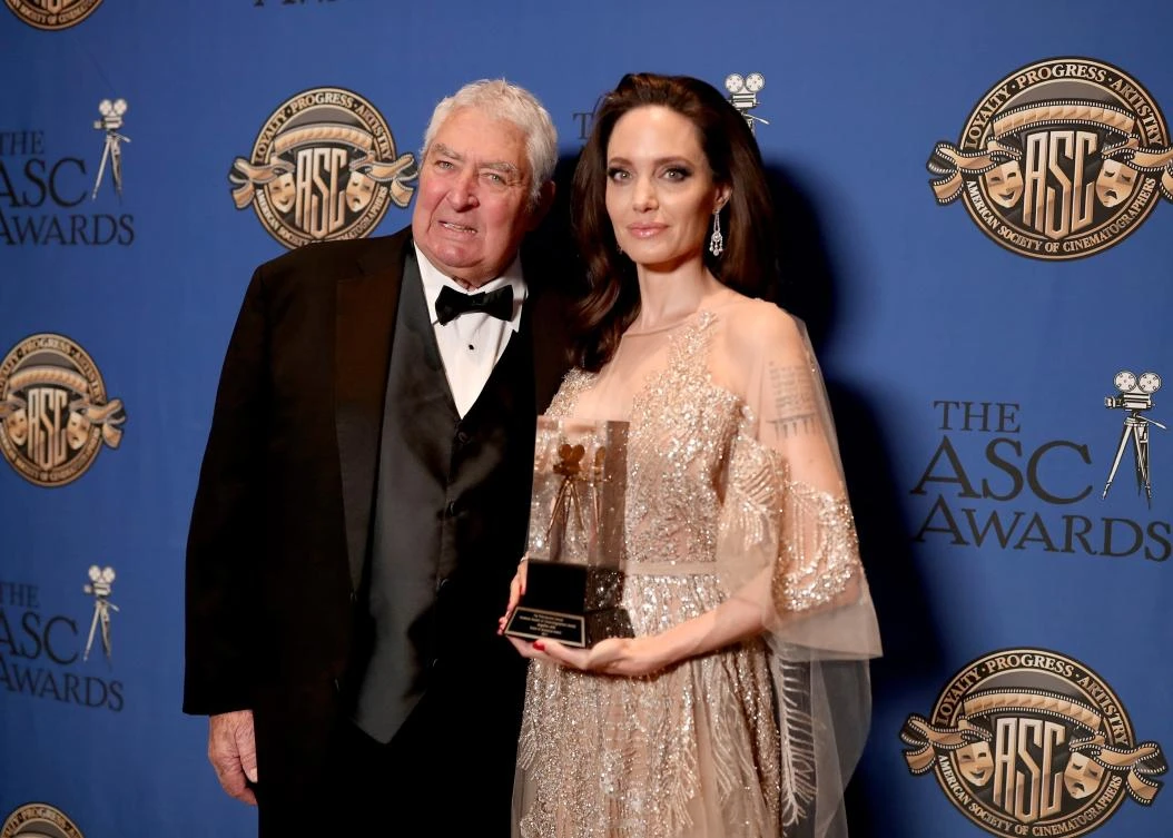 Dean Semler presents the Board of Governors award to Angelina Jolie during the 32nd Annual American Society Of Cinematographers Awards at The Ray Dolby Ballroom at Hollywood & Highland Center in Hollywood, California. Jolie shines in stunning Elie Saab gown. (AFP)