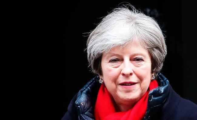 May launches review of high UK university fees, promising fairer deal
