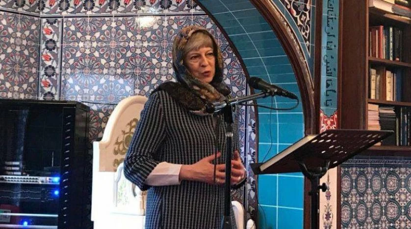 UK PM Theresa May wearing a scarf during her visit to a mosque in Maidenhead near London on Sunday.