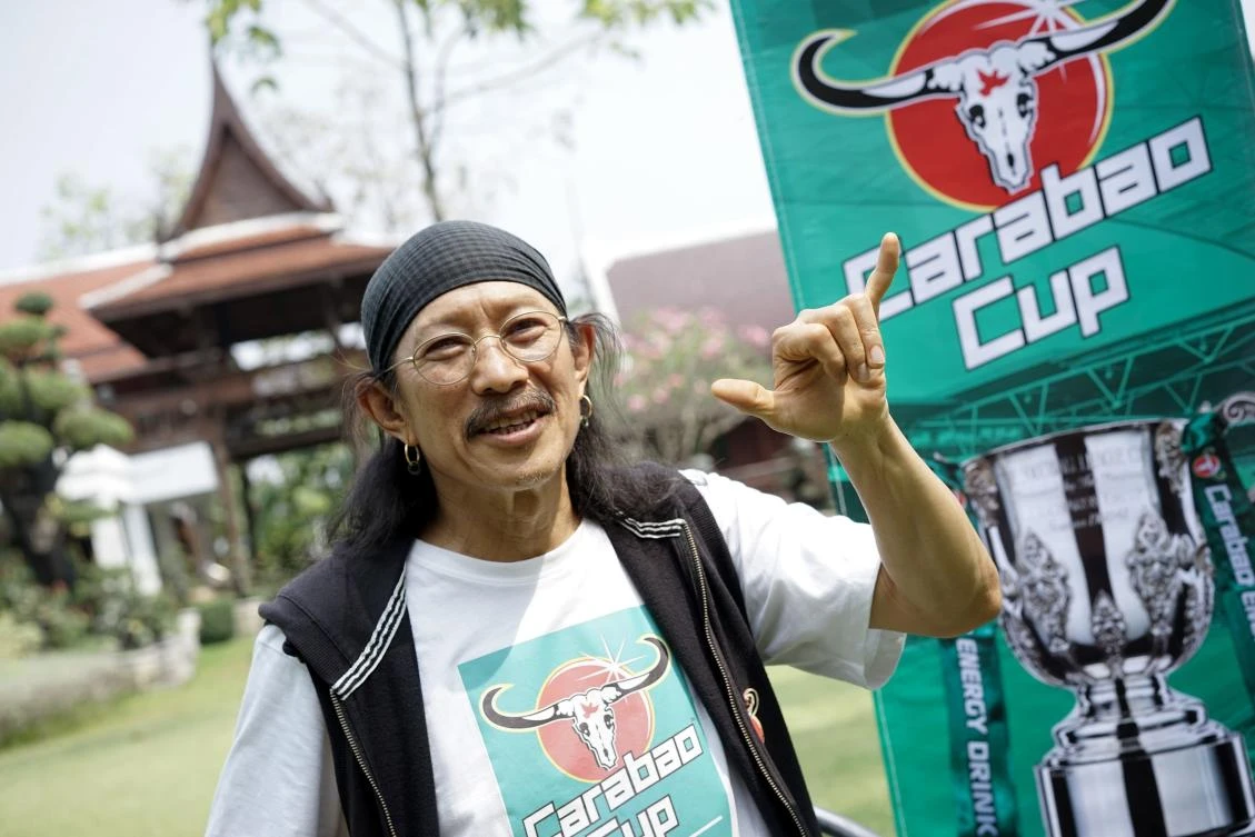 This photograph taken on February 17, 2018 shows Yuenyong Opakul, 63, lead singer of legendary Thai rock band Carabao and owner of Carabao energy drink, posing for a portrait outside his home in Bangkok. (AFP)