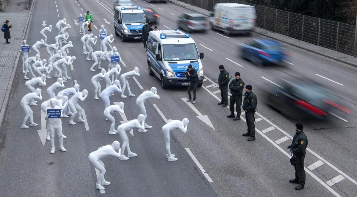 Greenpeace activists wear white morphsuits as they stage an action against particulate matter and health burden caused by diesel exhaust on February 19, 2018 in Stuttgart, southern Germany. (AFP)